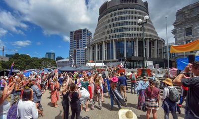 New Zealand will lift Covid restrictions only when ‘well beyond’ peak, Jacinda Ardern says