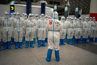 AP PHOTOS: Bye bye bubble — but 1 final zero-COVID reminder