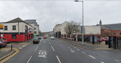 Falls Road: Woman taken to hospital after two-vehicle collision in West Belfast