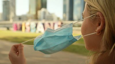 Queensland records five more COVID-19 deaths as easing of mask requirements, density limits announced