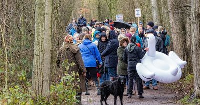 More than 100 people and giant swan take part in protest over planned watersports at Balderton Lake