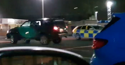 Idiot driver circles Scots cop motor in car park rampage