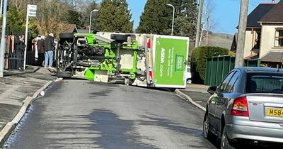 Asda van overturns after crash with car
