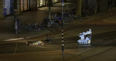 Amsterdam hostage incident: Gunman mown down by police as victims released after 5 hours