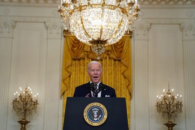 Biden announces first tranche of Russia sanctions, targets banks and debt