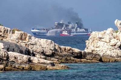 Greece halts search for 10 missing in ferry fire to tow ship