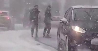 Drivers stranded in their cars during blizzard rescued by good Samaritans