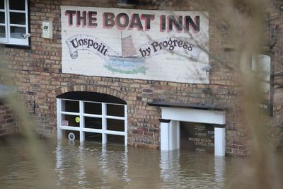 Wind and snow warnings issued as flooding risks remain