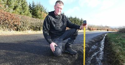 Furious biker fears dangerous potholes could kill motorists on Lanarkshire road