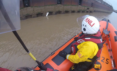 Cat left clinging to Norfolk river bank gets salmon treat after lifeboat rescue