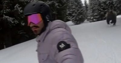 Terrified snowboarder spots deadly animal chasing him when watching video back