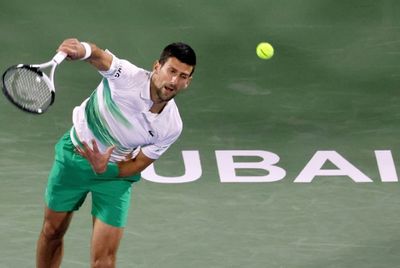 Business as usual as Djokovic reaches 10th successive quarter-final