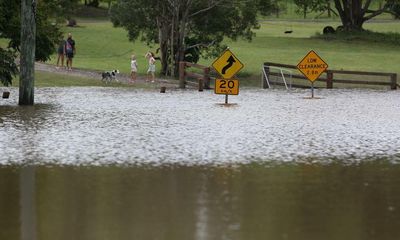 NSW and Queensland brace for more heavy rain as body of motorcyclist missing in floods found