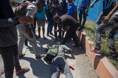 1 killed, 2 wounded as police clash with Haitian workers