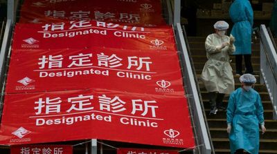 Virus-hit Hong Kong Invokes Emergency Powers to Allow in China Medics