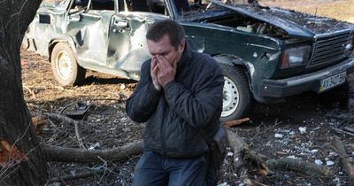 Ukrainian mourns near body of man killed in Russian strike in harrowing war scene