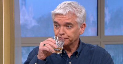 Holly and Phil 'drown their sorrows' with whisky live on This Morning after Ukraine news