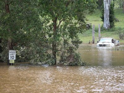 Two dead as Qld braces for more rain