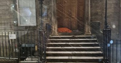 Anger as Scot pictured sleeping in doorway during heavy snow