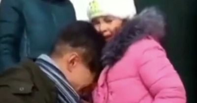 Ukrainian dad's heartbreaking goodbye to family going to safe zone as he stays to fight