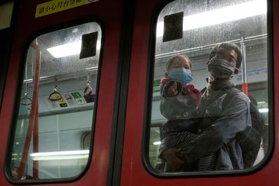 Hong Kong families despair as COVID rules may separate them from children