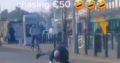 Footage shows man falling while chasing €50 note caught in the wind as Dublin pub offers him pint
