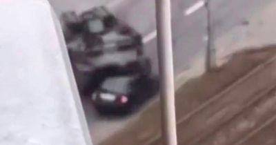 Russian tank swerves to crush car in Kyiv - but driver miraculously somehow SURVIVES