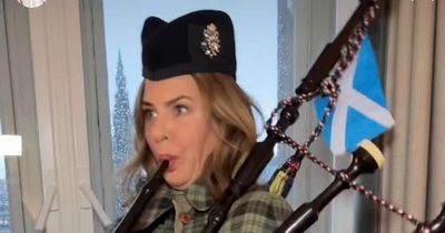 Fashion guru Trinny Woodall tries out the bagpipes during a visit to Scotland
