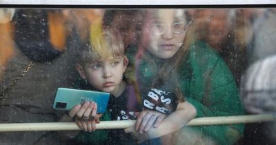 Ukraine civilians scream in terror as panicked crowds flee gunfire at train station