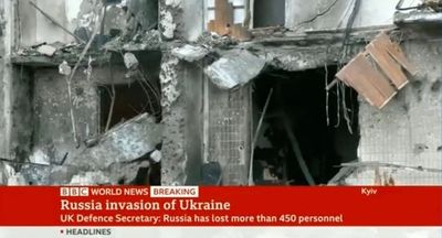 BBC reporter sees pictures of partially destroyed family home during broadcast on Kyiv bombing