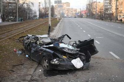 Shocking video shows moment military vehicle drives over car in Kyiv