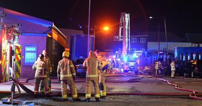 Huge fire and police presence as blaze rips through building