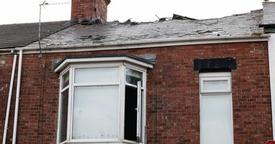 Police remain at the scene fire in Sunderland as images this morning show damage to roof