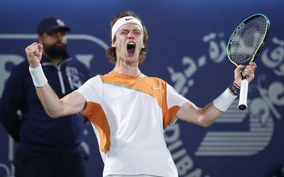 Russian tennis star Andrey Rublev writes 'No War Please' on TV camera after win