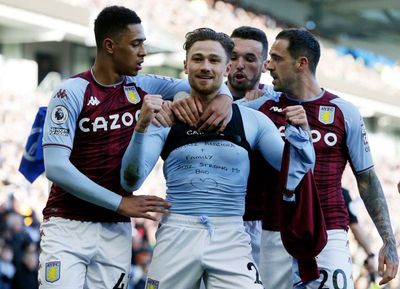 Matty Cash: Aston Villa defender booked after removing shirt to reveal support of family in Ukraine