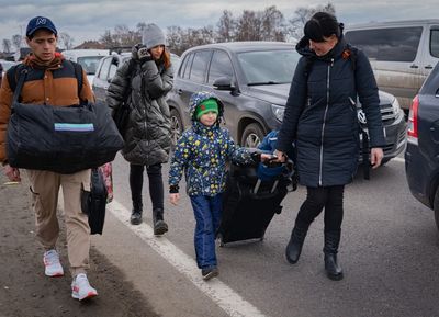 The 40-km queue to flee Ukraine: Thousands of families rush to leave as Russian army advances