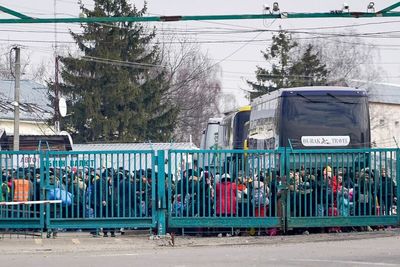 Long queues form at central Europe border crossings as people flee Ukraine
