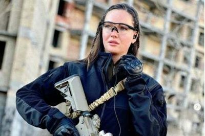 Former Miss Ukraine takes up arms to fight Russian invaders