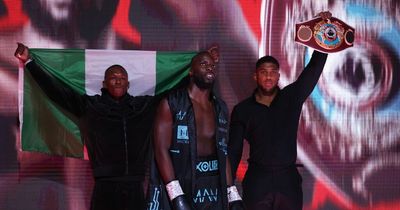 Anthony Joshua and Israel Adesanya walk out with Lawrence Okolie for world title win