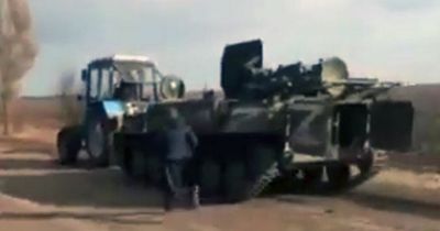 Moment Ukrainian tractor 'steals huge Russian armoured vehicle' in clip shared by MP