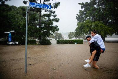 Rooftop rescues as tens of thousands evacuated from Australia floods