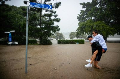 Rooftop rescues as tens of thousands evacuated from Australian floods