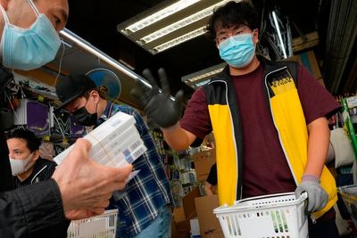 Hong Kong considers lockdown as daily infections top 34,000