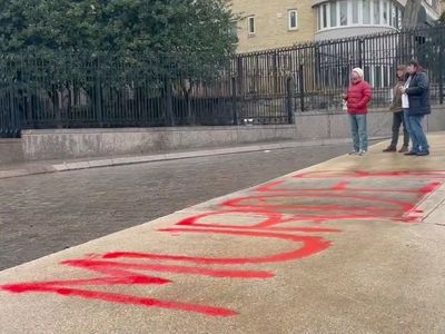 Protester graffitis ‘murder’ in bright red paint outside Russian embassy in DC