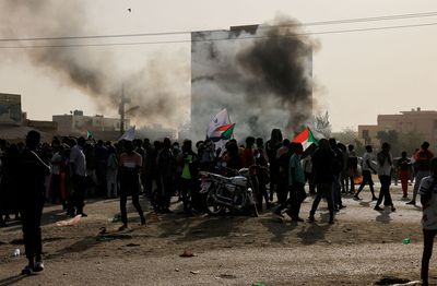 Sudanese protesters against military rule defy tear gas to reach palace gates