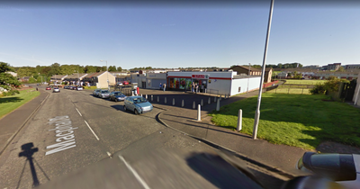 Armed thug robs Kilmarnock shop as police try to trace man in high-viz jacket