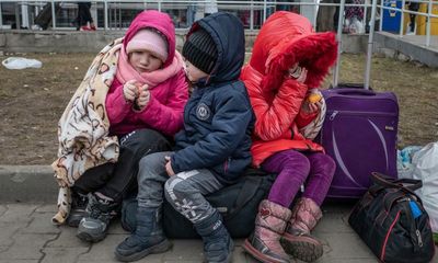 ‘I left everything’: Tens of thousands of Ukrainians seek safety in neighbouring Poland