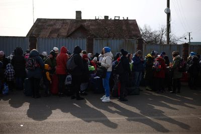 Ukrainians face long journeys to borders as fighting escalates