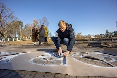 Vilnius mayor paints 'Putin the Hague is waiting for you' opposite embassy