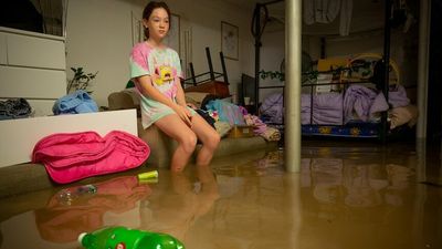 Logan River family grieves the flood's damage to their home, while vowing to survive it